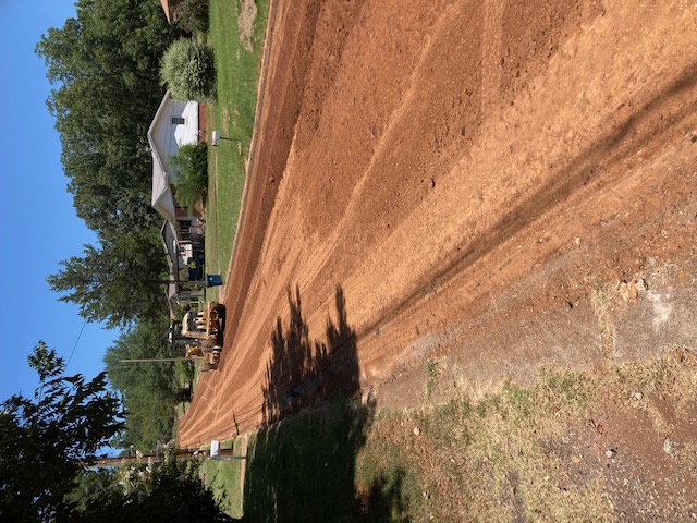 dirt road with work being done.