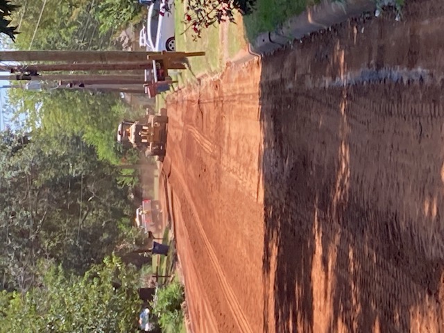 dirt road with equipment working on road