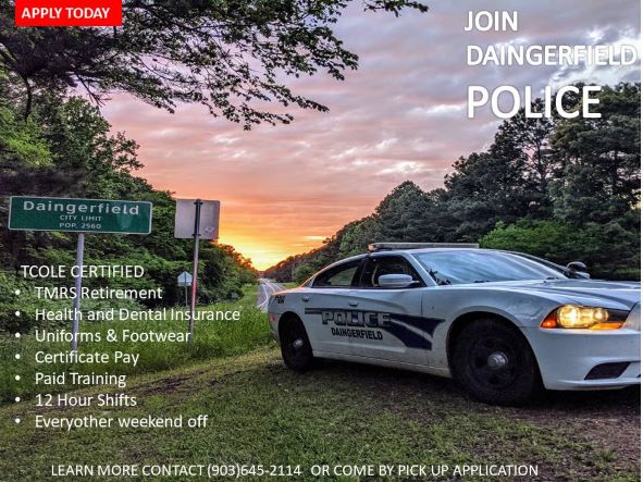 Police Car and City Limit Sign